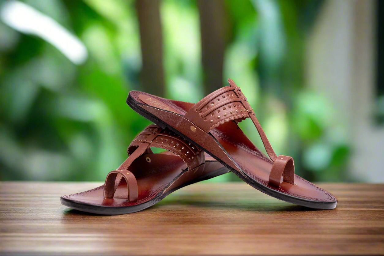 Pair of brown sandals on a white background