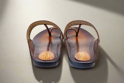 Pair of brown sandals on a white background