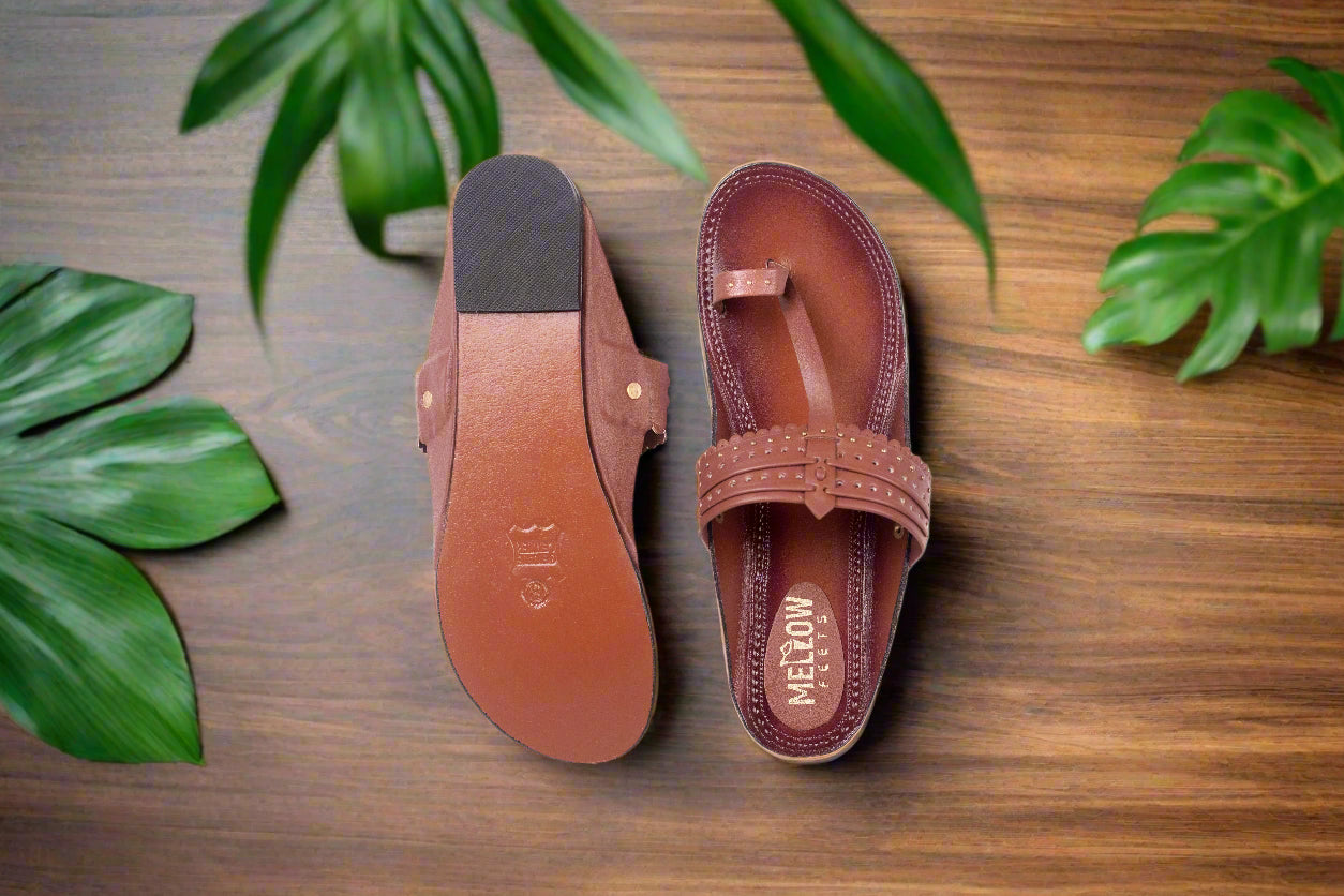 Brown sandal with a strap on a white background