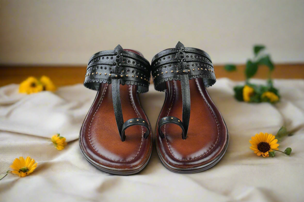 Traditional black Kolhapuri sandals with elegant detailing