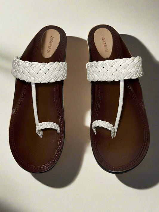 Traditional brown leather sandals with white braided detailing on the strap and toe loop, featuring a sleek open-back design.