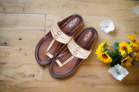 Beige handcrafted Kolhapuri chappals on brown leather sole – top view